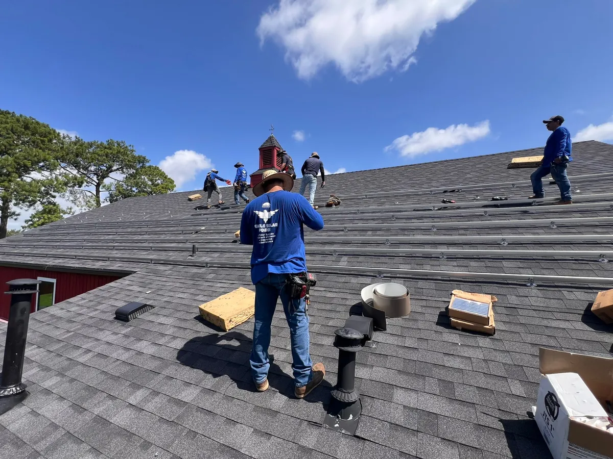 Eagle Solar Power crew working on a shingle roof
